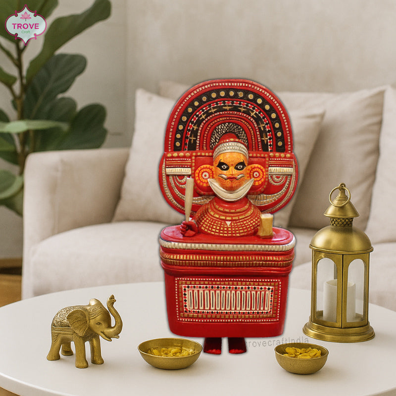 wooden sculpture of a Theyyam peformer