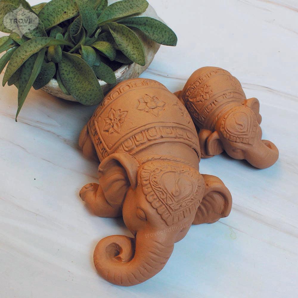 clay elephants sleeping