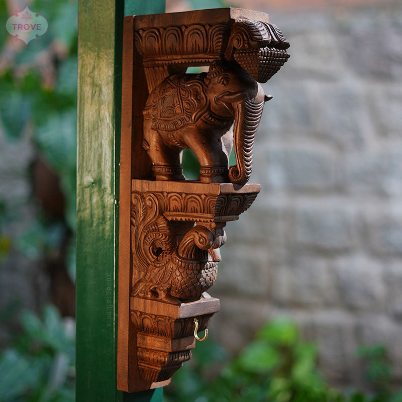 Carved elephant brackets